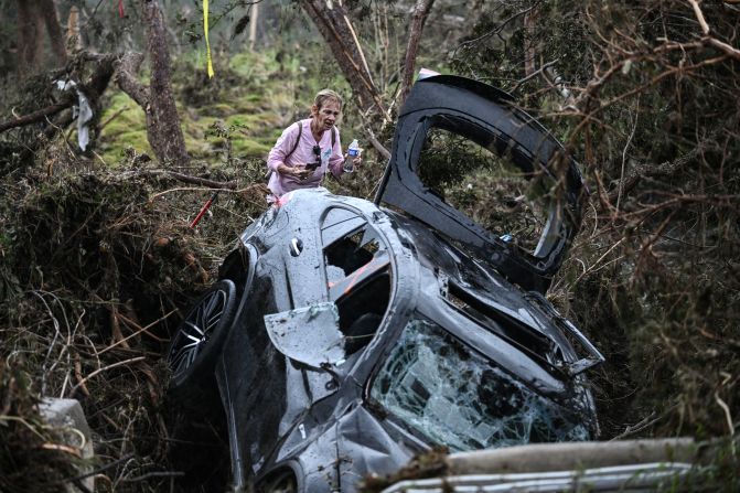 A volunteer looks for missing people in Hunt, Texas.