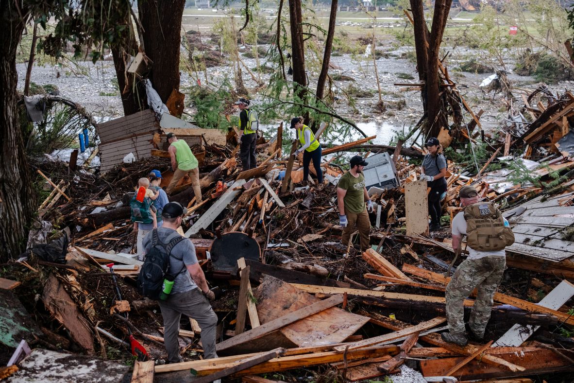 Search-and-rescue workers dig through debris in Hunt on Sunday.