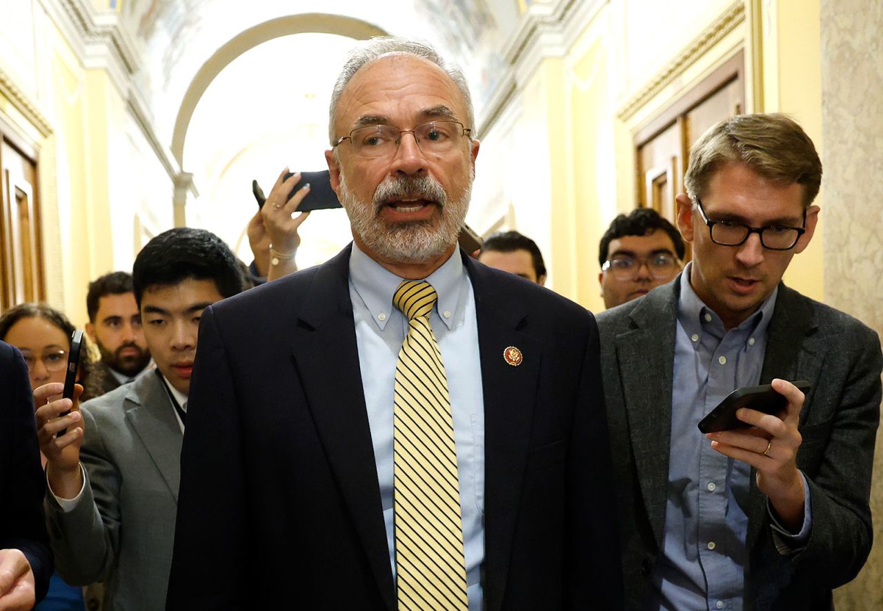 Freedom Caucus Chair Rep. Andy Harris talks to reporters as he walks to the House Chamber on Wednesday.