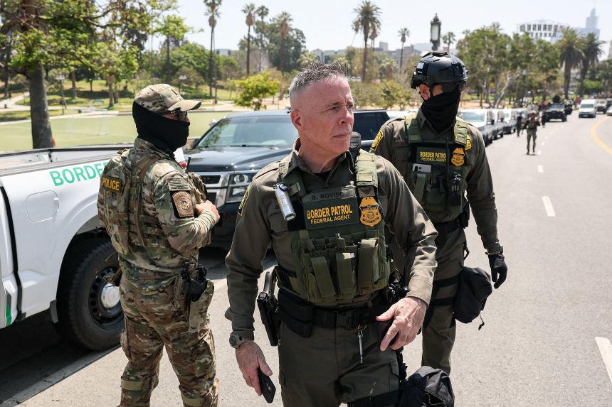 Gregory Bovino, US Border Patrol El Centro Sector Chief, walks in Los Angeles' MacArthur Park as a large group of federal law enforcement officers arrive on July 7, 2025.