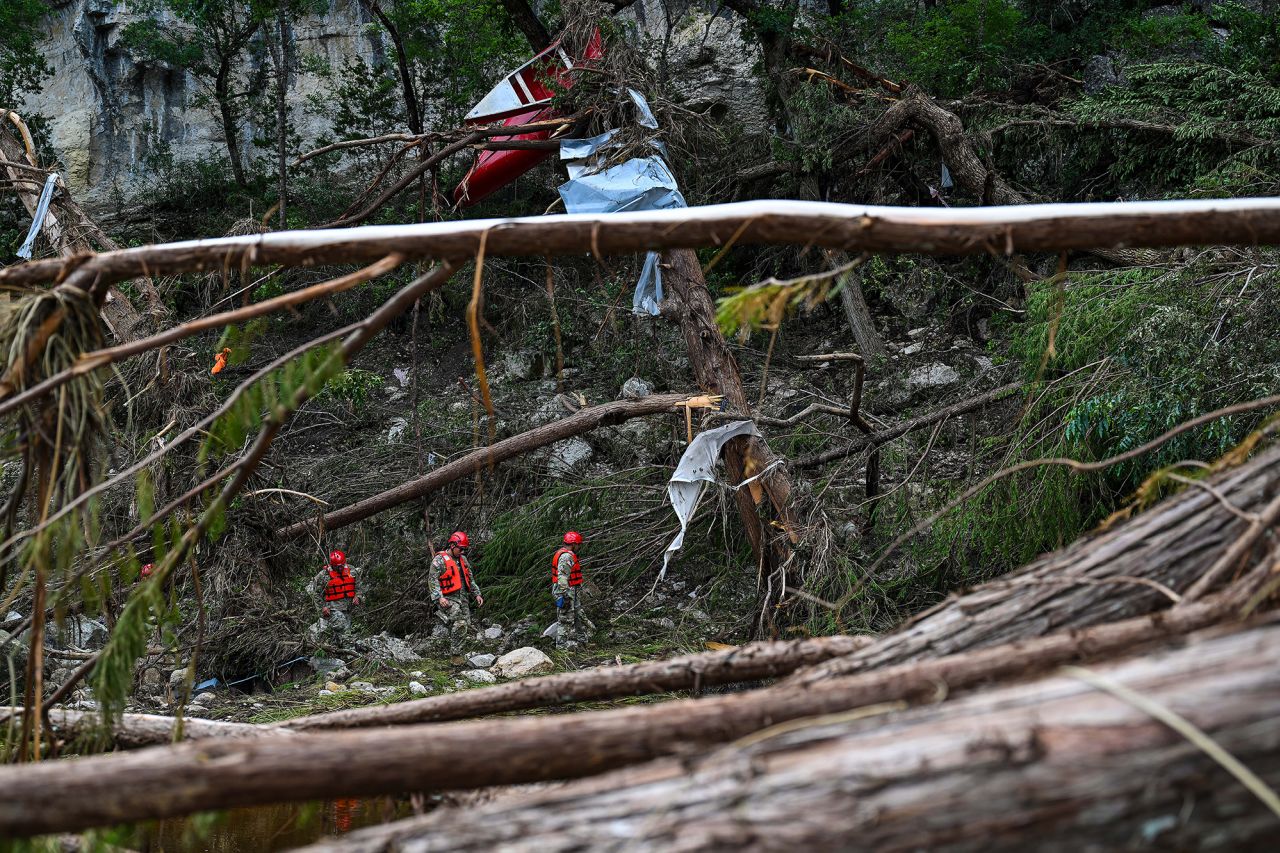 Search and rescue personnel continue to look for missing people along the Guadalupe River on in Hunt, Texas, on Monday.