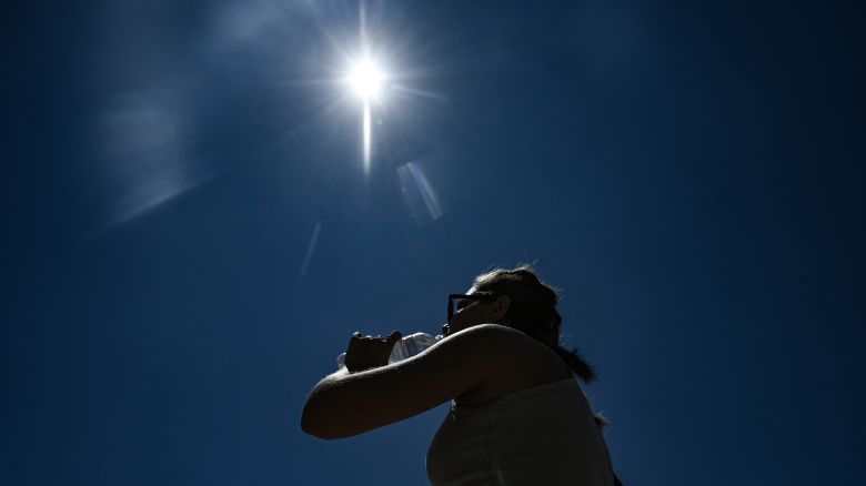 A tourist drinks water during a heatwave in Thessaloniki on July 8, 2025. A four-day heatwave confirmed by meteorologists began in Greece on July 6, is the second to grip Greece since late June. Temperatures are expected to reach 42 Celsius (107.6 Fahrenheit), with a maximum of 38 Celsius in Athens and increase as the week continues.