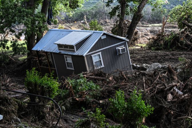 A damaged house is seen near the Guadalupe River in Hunt, Texas, on Tuesday, July 8.
