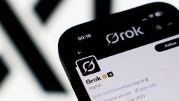 The xAI logo and Grok account on X displayed on a phone screen in a illustration photo taken in London on July 9. XAI apologized Saturday for antisemitic social media posts this week.
