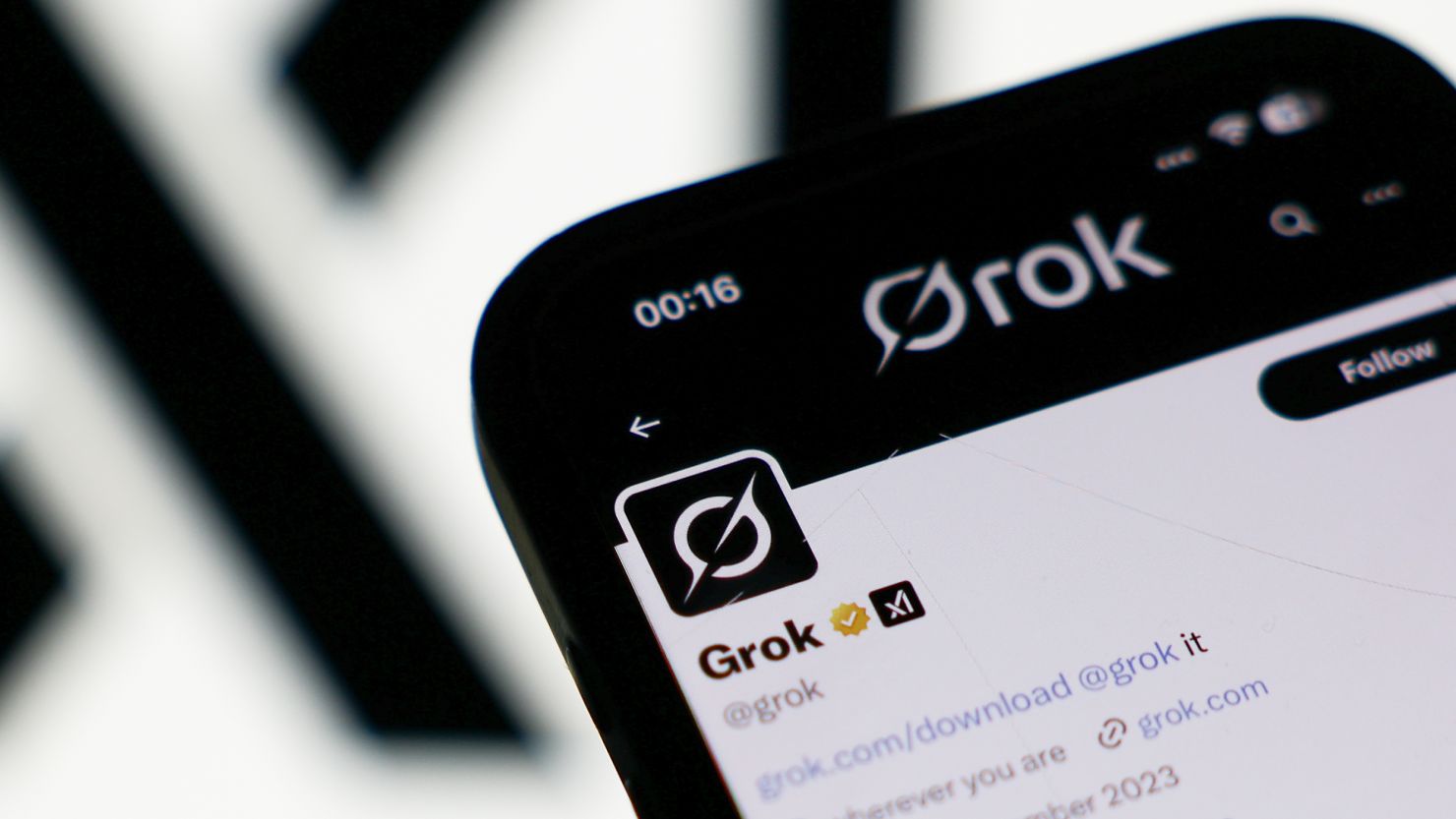 The xAI logo and Grok account on X displayed on a phone screen in a illustration photo taken in London on July 9. XAI apologized Saturday for antisemitic social media posts this week.