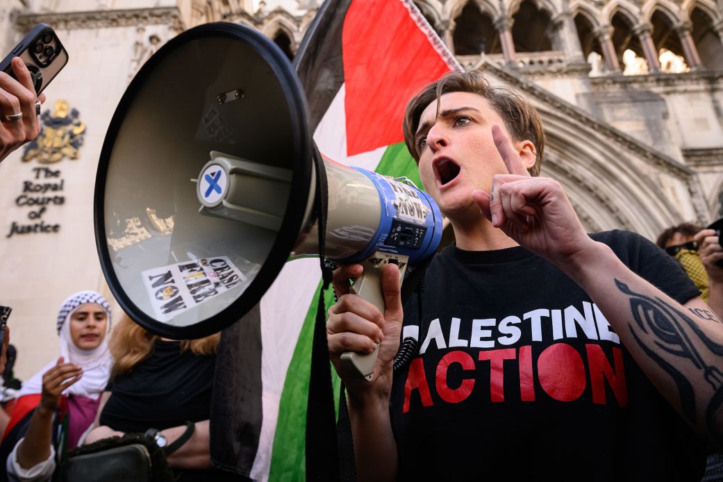 A Palestine Action activist reacts outside London's Royal Courts of Justice after a legal challenge to suspend the group’s proscription under anti-terrorism laws failed on July 4, 2025.