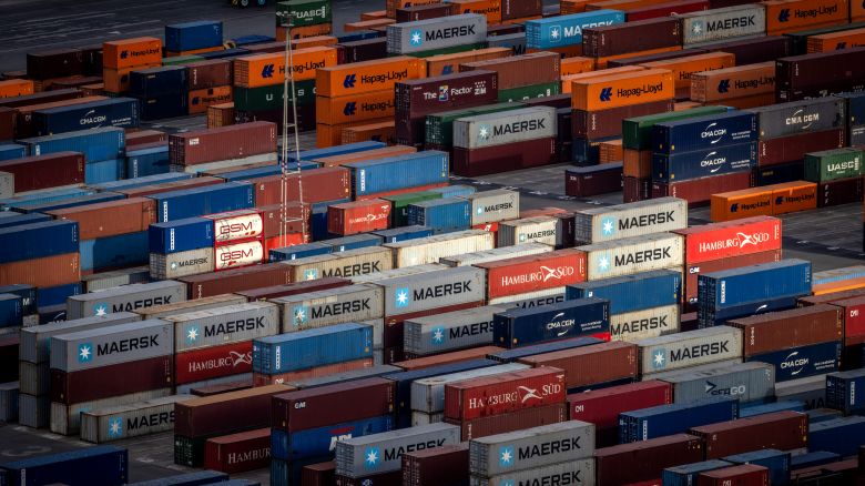 Stacked shipping containers in the commercial port of Barcelona, Spain, on Monday, July 7, 2025. The EU is said to be seeking a preliminary agreement with the US that would allow it to lock in a 10% tariff rate beyond an Aug. 1 deadline.