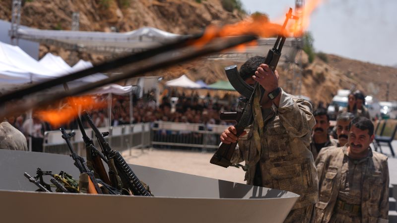 Kurdish PKK militants burn weapons in landmark step to end decades-long Turkey conflict