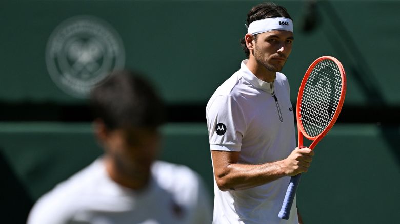US player Taylor Fritz reacts as he plays against Spain's Carlos Alcaraz during their men's singles semi-final tennis match on the twelfth day of the 2025 Wimbledon Championships at The All England Lawn Tennis and Croquet Club in Wimbledon, southwest London, on July 11, 2025.