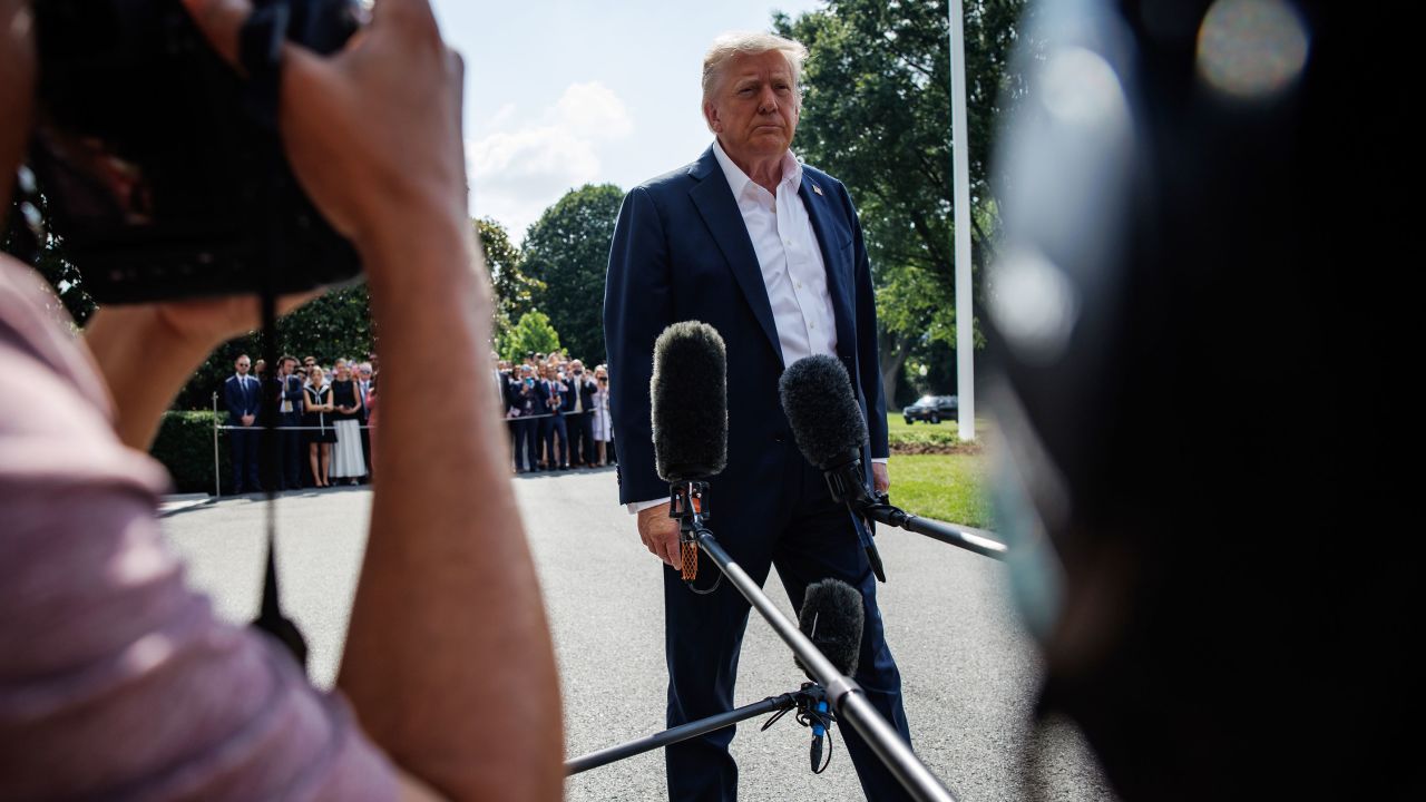 President Donald Trump speaks to members of the media on the South Lawn of the White House in Washington, DC, before boarding Marine One on Friday.