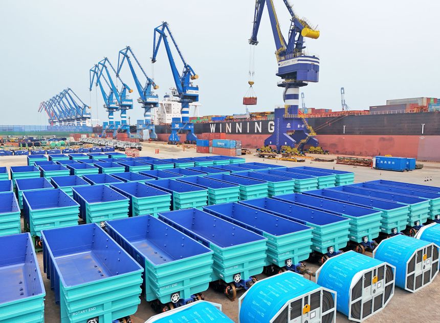 A large batch of goods, including dump trucks, is assembled at the Yantai Port for export to Africa on July 7, 2025 in Yantai, Shandong Province of China.
