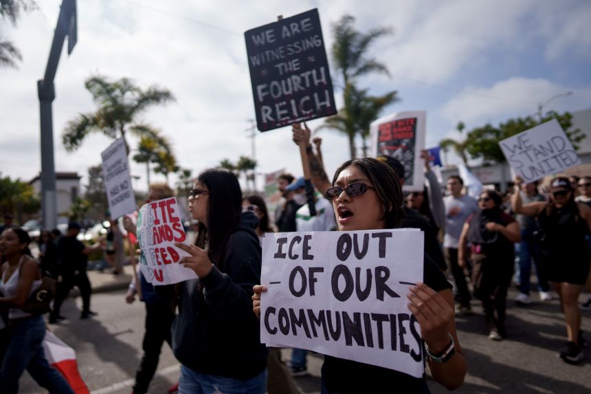 People attend a rally and march on July 11, 2025 in Oxnard, California, a day after around 200 people were detained by federal officers during a raid at a cannabis farm in nearby Camarillo.