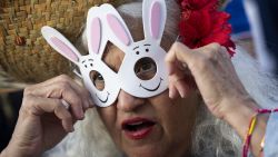 A woman wears a bunny rabbit mask before the start of the first show of Puerto Rican singer Bad Bunny's 30-date concert residency at the Coliseo de Puerto Rico in San Juan, Puerto Rico, on July 11, 2025. (Photo by Ricardo ARDUENGO / AFP) (Photo by RICARDO ARDUENGO/AFP via Getty Images)