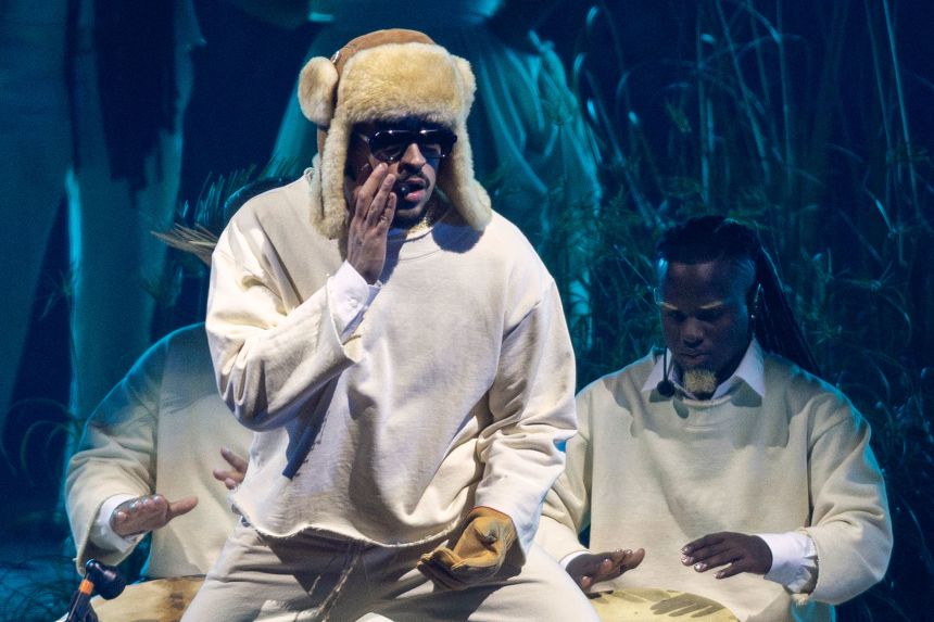 Bad Bunny performs onstage at the Coliseo in July 2025.