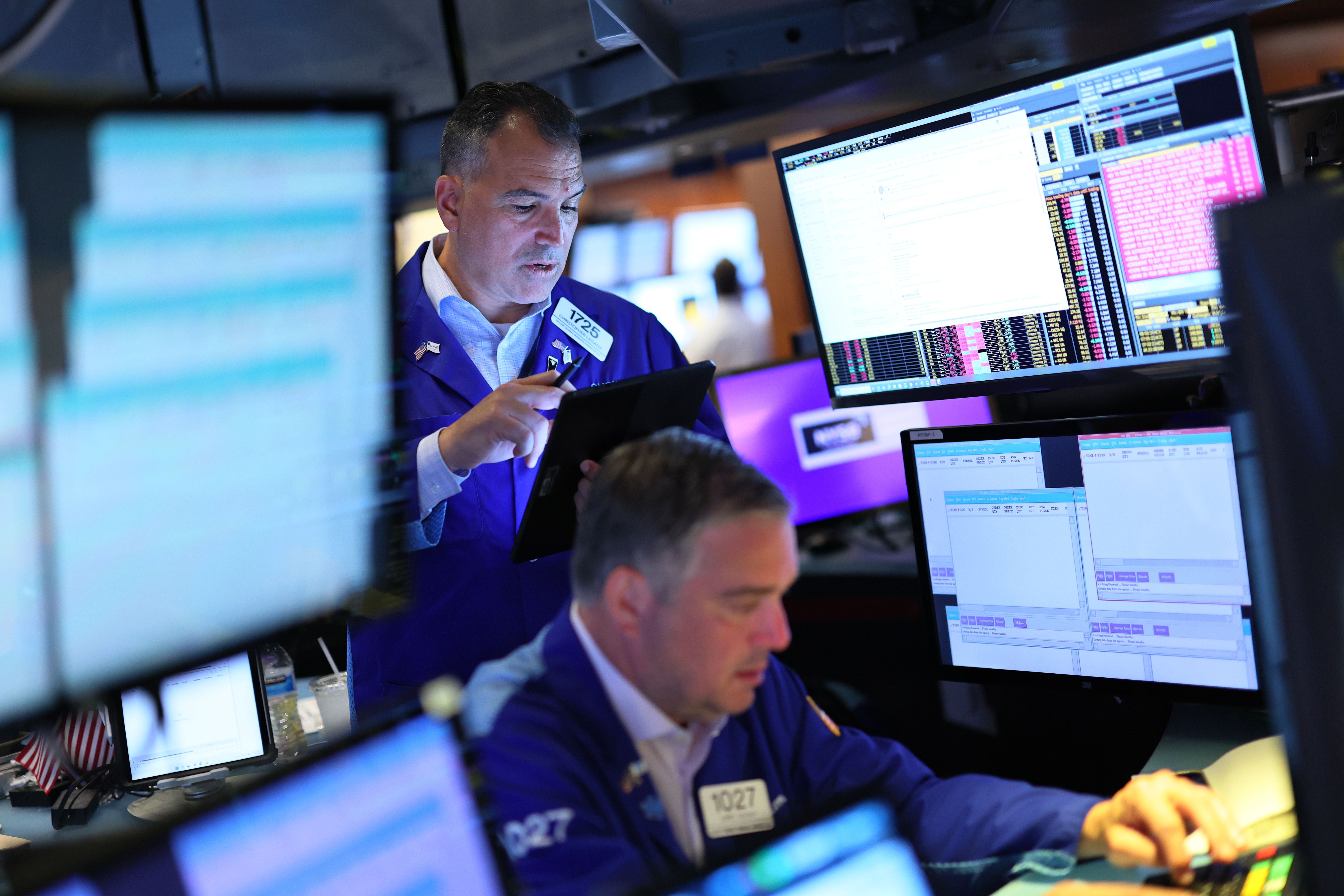 Traders work on the floor of the New York Stock Exchange.