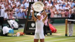 Poland's Iga Swiatek celebrates with the winner's trophy, the Venus Rosewater Dish, after winning against US player Amanda Anisimova during their women's singles final tennis match on the thirteenth day of the 2025 Wimbledon Championships at The All England Lawn Tennis and Croquet Club in Wimbledon, southwest London, on July 12, 2025. (Photo by HENRY NICHOLLS / AFP) / RESTRICTED TO EDITORIAL USE (Photo by HENRY NICHOLLS/AFP via Getty Images)          