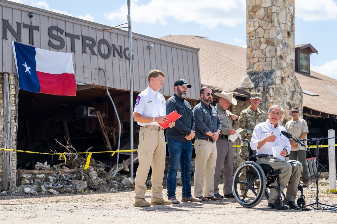 Texas Gov. Greg Abbott speaks at a news conference in Hunt on Tuesday. “We’re going to address every aspect of this storm to make sure that we’re going to have in place the systems that are needed to prevent deadly flooding events like this in the future,” he said.