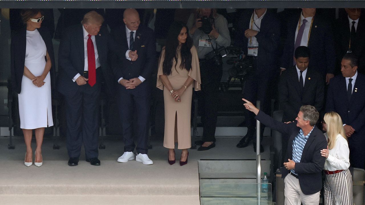 US President Donald Trump (2nd-L) gives a thumbs up to US Attorney General Pam Bondi (R) and her partner John Wakefield ahead of the FIFA Club World Cup 2025 final football match between England's Chelsea and France's Paris Saint-Germain at the MetLife Stadium in East Rutherford, New Jersey on July 13, 2025. (Photo by CHARLY TRIBALLEAU / AFP) (Photo by CHARLY TRIBALLEAU/AFP via Getty Images)          