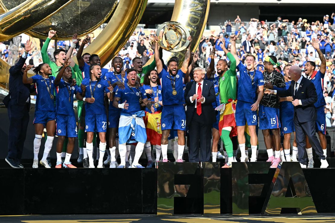 Chelsea players lift the Club World Cup trophy along with President Donald Trump and FIFA president Gianni Infantino.