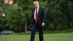 President Donald Trump walks on the South Lawn upon arrival at the White House in Washinton DC, on Sunday.