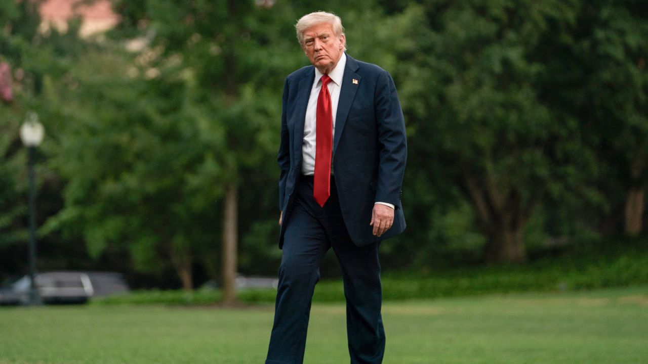 President Donald Trump walks on the South Lawn upon arrival at the White House in Washinton DC, on Sunday.
