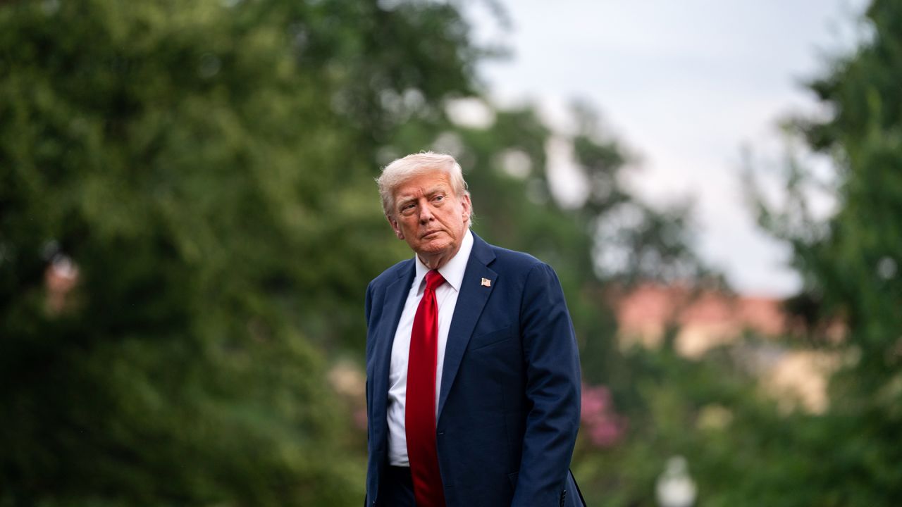 US President Donald Trump walks on the South Lawn of the White House after arriving on Marine One in Washington, DC, US, on Sunday, July 13, 2025.