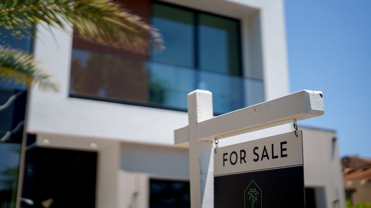 A "For Sale" sign in front of a home in the Encino neighborhood of Los Angeles, California, US, on Sunday, July 13, 2025. Like in the broader US market, home sales have slowed in Southern California as high interest rates and economic uncertainty chill demand.