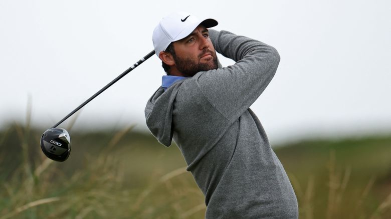 US golfer Scottie Scheffler watches his drive from the 8th tee during practice ahead of the 153rd Open Championship at Royal Portrush golf club in Northern Ireland on July 15, 2025. (Photo by HENRY NICHOLLS / AFP) / RESTRICTED TO EDITORIAL USE (Photo by HENRY NICHOLLS/AFP via Getty Images)          