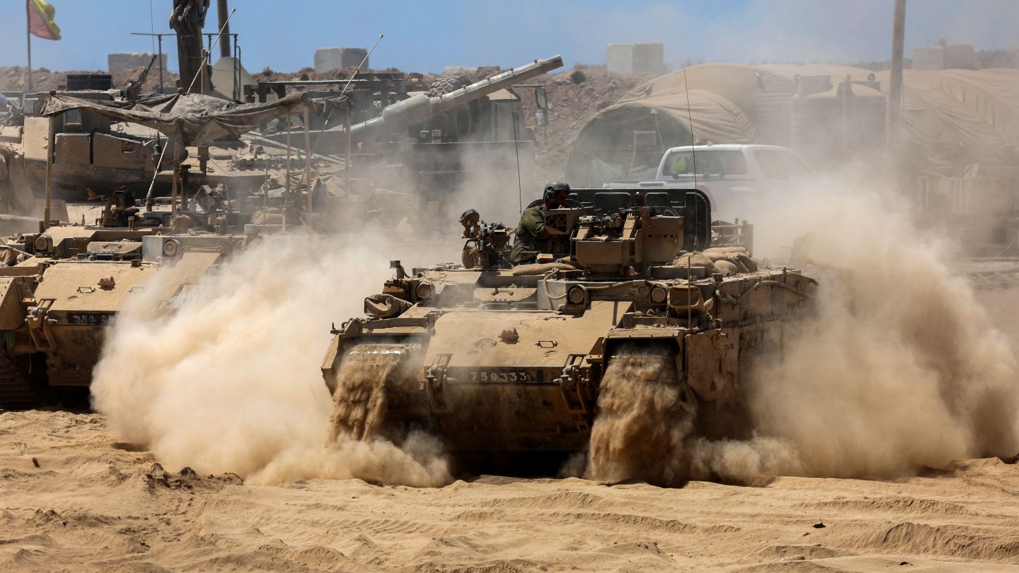 Israeli troops deploy tanks near the Gaza border on July 15.
