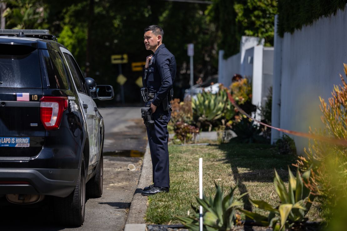 Los Angeles Police Department officials secure the home where Robin Kaye an