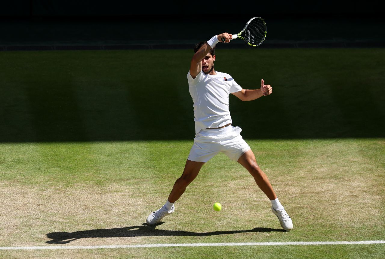 Carlos Alcaraz hits a shot during his semifinal match against Taylor Fritz on Friday.