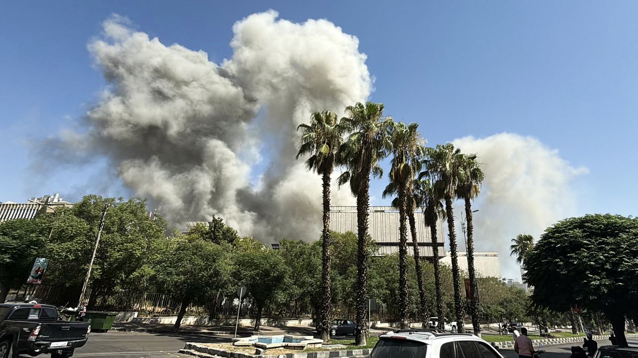 TOPSHOT - Smoke billows following Israeli strikes near the Syrian army and defence ministry headquarters in Damascus on July 16, 2025. (Photo by Rami al SAYED / AFP) (Photo by RAMI AL SAYED/AFP via Getty Images)          