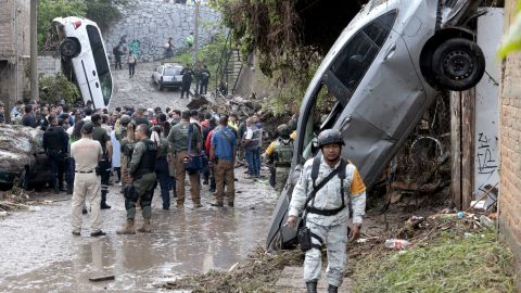 An army soldier patrols the area affected by flash flooding due to heavy rains in Zapopan, Jalisco state, Mexico on July 16, 2025. At least one minor died and dozens of homes and streets were flooded after heavy rains hit the municipality of Zapopan in western Mexico on Tuesday night. (Photo by ULISES RUIZ / AFP) (Photo by ULISES RUIZ/AFP via Getty Images)          