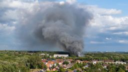 TOPSHOT - Smoke caused by a fire billows above the site of the Tomorrowland electronic music festival in Boom, northern Belgium on July 16, 2025. (Photo by Tom Goyvaerts / Belga / AFP) / Belgium OUT (Photo by TOM GOYVAERTS/Belga/AFP via Getty Images)          