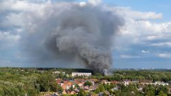 TOPSHOT - Smoke caused by a fire billows above the site of the Tomorrowland electronic music festival in Boom, northern Belgium on July 16, 2025. (Photo by Tom Goyvaerts / Belga / AFP) / Belgium OUT (Photo by TOM GOYVAERTS/Belga/AFP via Getty Images)          