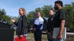 Rep. Debbie Wasserman Schultz, left, Rep. Darren Soto, Rep. Jared Moskowitz, second from right, and Rep. Maxwell Frost, right, speak to the media before visiting "Alligator Alcatraz" at the Dade-Collier Training and Transition Airport in Ochopee, Florida, on Saturday.