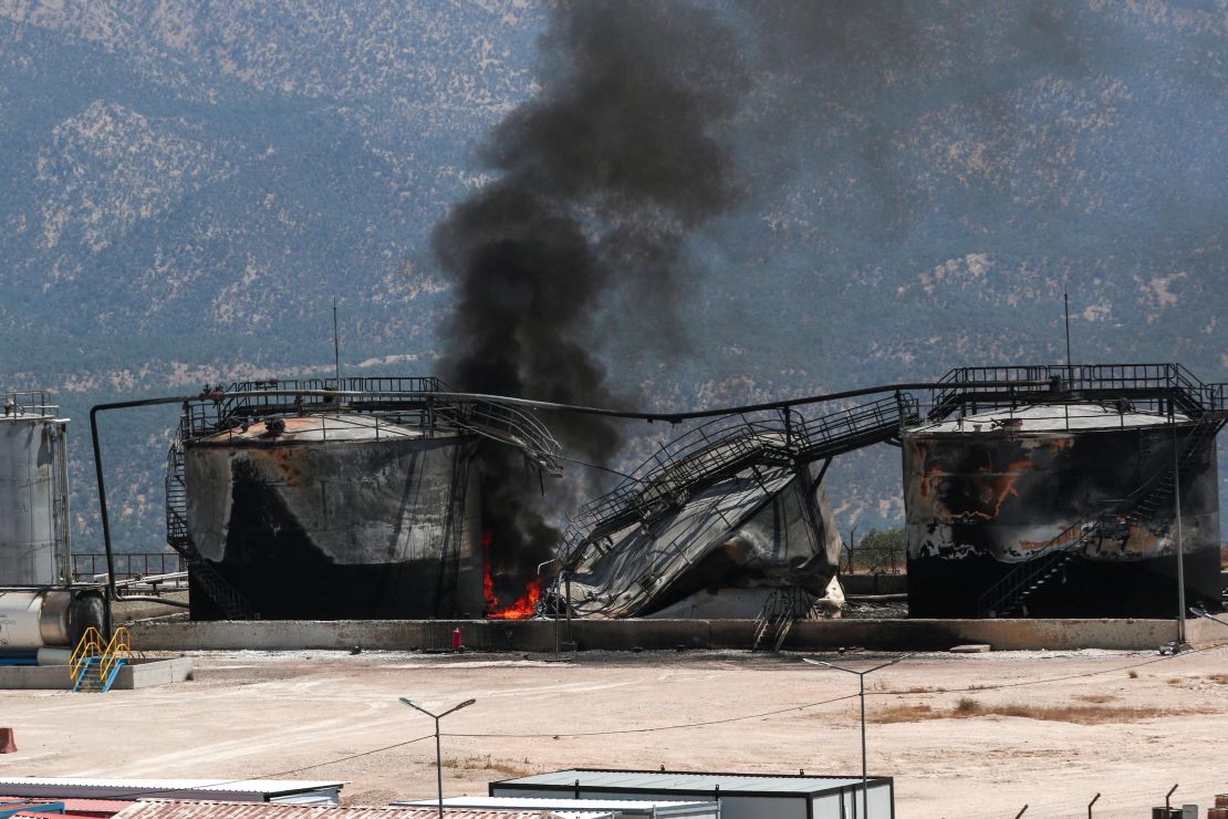 Smoke billows from a damaged oil installation at the Sarsang oil field following a drone attack on the Chamanke district near the Kurdish city of Dohuk in northern Iraq's autonomous Kurdish region on July 16.