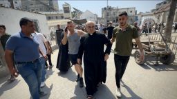 GAZA CITY, GAZA - JULY 17: Wounded Palestinians, including Father Jebrail Romanelli, are brought to Al-Ahli Baptist Hospital after an Israeli attack targeted the Holy Family Church in eastern Gaza City, Gaza on July 17, 2025. The Israeli military continues to carry out air and ground operations in densely populated civilian areas across the Gaza Strip. (Photo by Hamza Z. H. Qraiqea/Anadolu via Getty Images)
