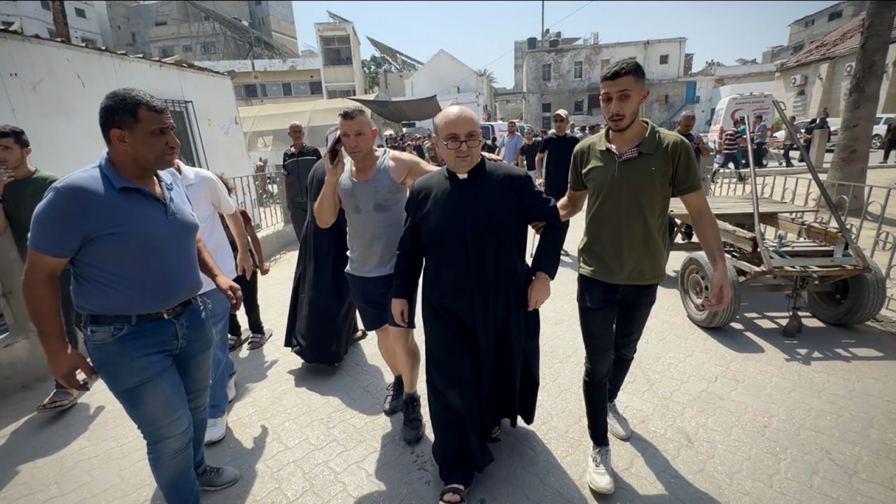 Wounded Palestinians, including Father Gabriel Romanelli, are brought to the Al-Ahli Baptist Hospital after a strike on the Holy Family Church in eastern Gaza City, Gaza on July 17, 2025.