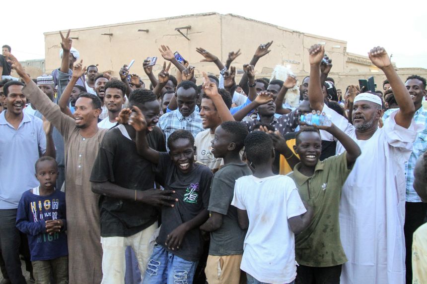 Fans and supporters cheers during the Sudanese Premier League football match between Hay Al-Wadi SC and Al-Hilal Omdurman at Berber City Stadium in Berber.