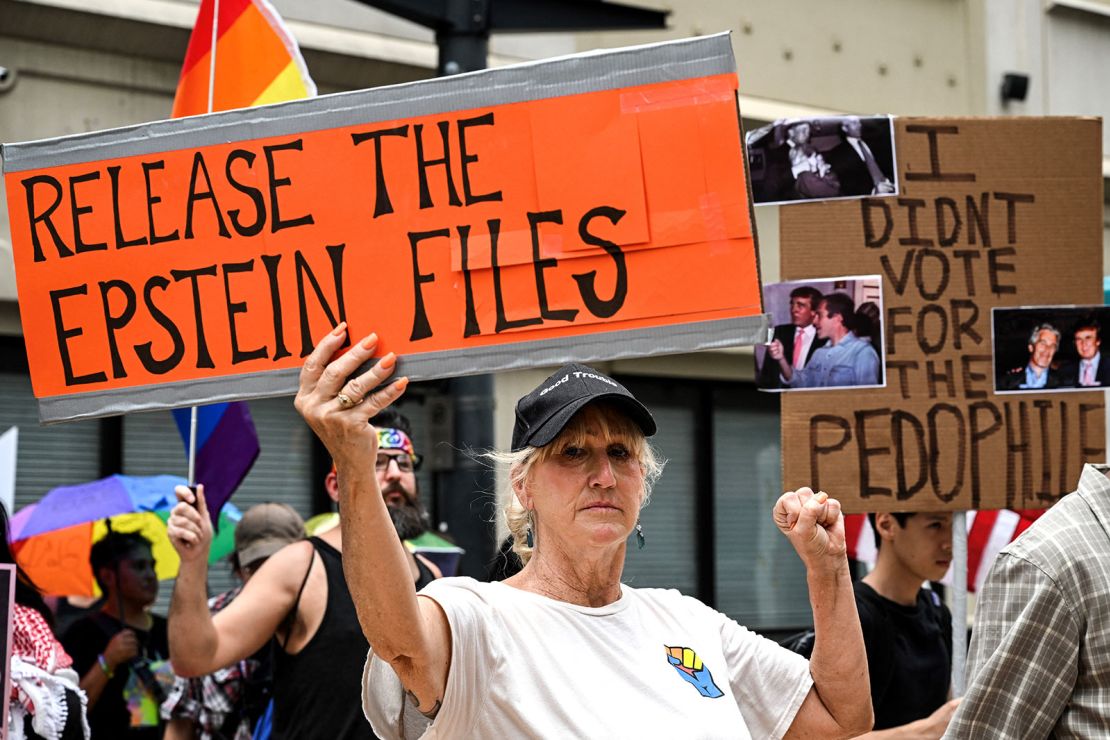 People holds signs calling for the release of files regarding Jeffrey Epstein participate in a protest as part of the 'Good Trouble Lives On' national day of action against the Trump administration in Houston, Texas, on Thursday.