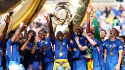EAST RUTHERFORD, NEW JERSEY - JULY 13: Moises Caicedo #25 of Chelsea FC lifts the FIFA Club World Cup trophy after his team's victory following the FIFA Club World Cup 2025 Final match between Chelsea FC and Paris Saint-Germain at MetLife Stadium on July 13, 2025 in East Rutherford, New Jersey. (Photo by Dan Mullan/Getty Images)