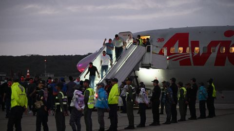 Venezuelan migrants who were jailed in El Salvador get off a plane at Simon Bolivar International Airport in Maiquetia, Venezuela on July 18, 2025.