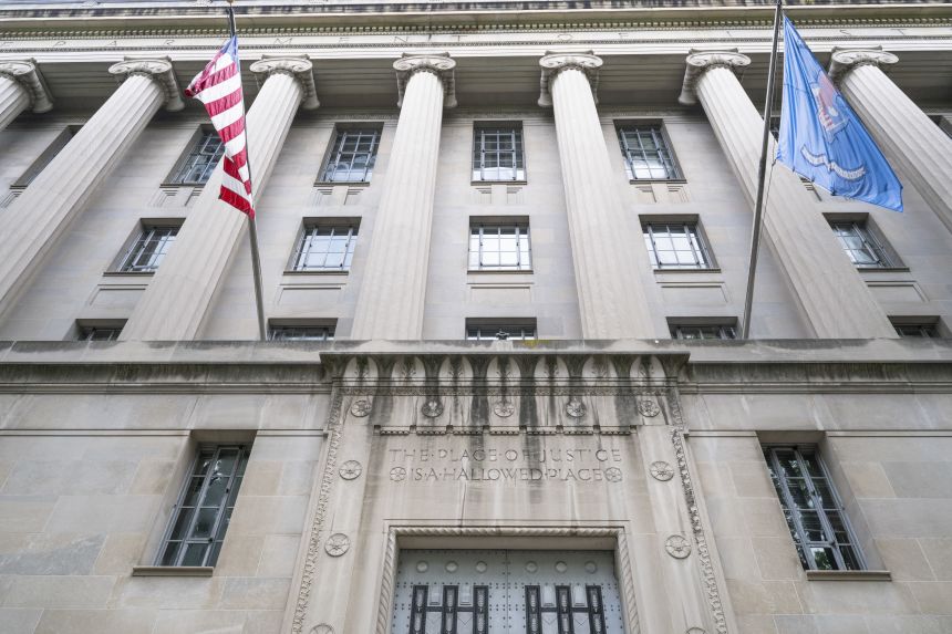 Etchings are seen on the walls near an entrance to the Department of Justice building on July 19, 2025, in Washington, DC.