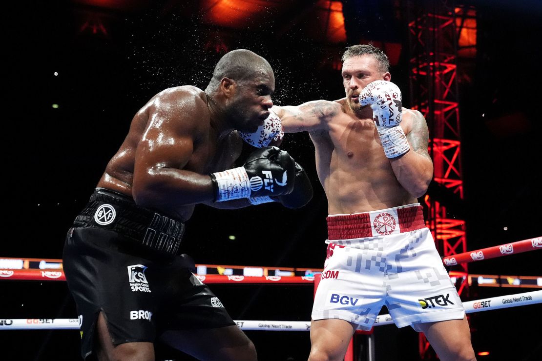 Oleksandr Usyk lands a punch on Daniel Dubois during their World Heavyweight bout at Wembley Stadium in London on July 19, 2025.