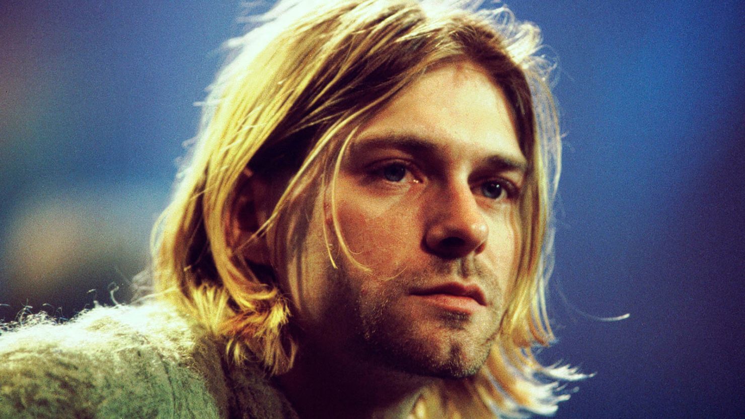 Kurt Cobain is pictured taping Nirvana's legendary "MTV Unplugged" performance in November 1993. A placard at the Museum of Pop Culture that apparently refers to his death by suicide with the word "unalived" has stirred controversy.