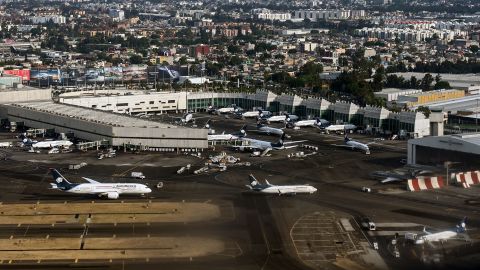 Planes of Mexican airline Aeromexico taxi at Benito Juarez International Airport in Mexico City on May 3, 2025. On July 19, 2025, the US Department of Transportation accused Mexican authorities of engaging in anti-competitive practices by rescinding flight slots from US airlines and forcing them to move their cargo operations to a terminal outside Mexico City. (Photo by Yuri CORTEZ / AFP) (Photo by YURI CORTEZ/AFP via Getty Images)          
