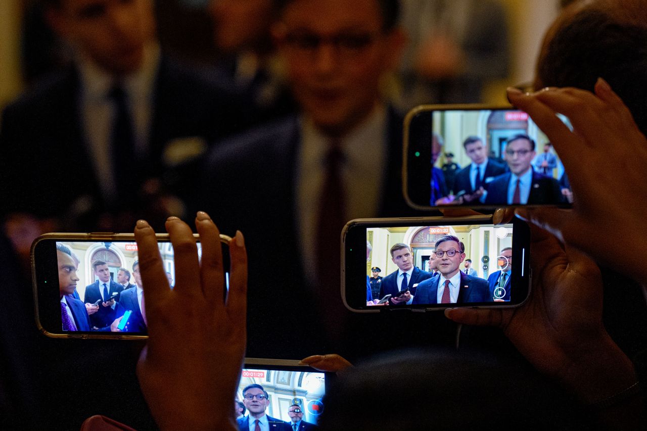 Members of the press record Speaker Mike Johnson as he speaks at the Capitol on Monday.