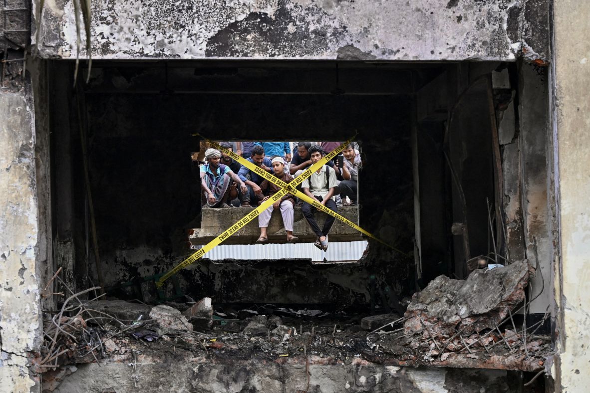 Crime scene tape cordons off part of the area where a Bangladeshi Air Force jet <a  target="_top" href="/newspapers?url=https://www.cnn.com/2025/07/21/asia/bangladesh-air-force-jet-dhaka-school-intl">crashed into a school in the capital of Dhaka</a> on Monday, July 21. At least 27 people, mostly children, were killed, according to officials.