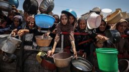 GAZA CITY, GAZA - JULY 22: Crowds form as Palestinians, including children, line up in Gaza City, Gaza to receive food distributed by a charity amid ongoing Israeli blockade and attacks on Gaza on July 22, 2025. (Photo by Ali Jadallah/Anadolu via Getty Images)